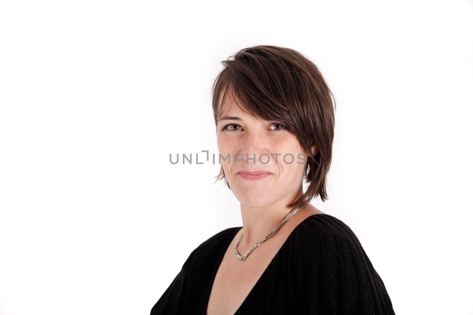 variation of expression on the face of a young brunette woman in studio with a colored scarf