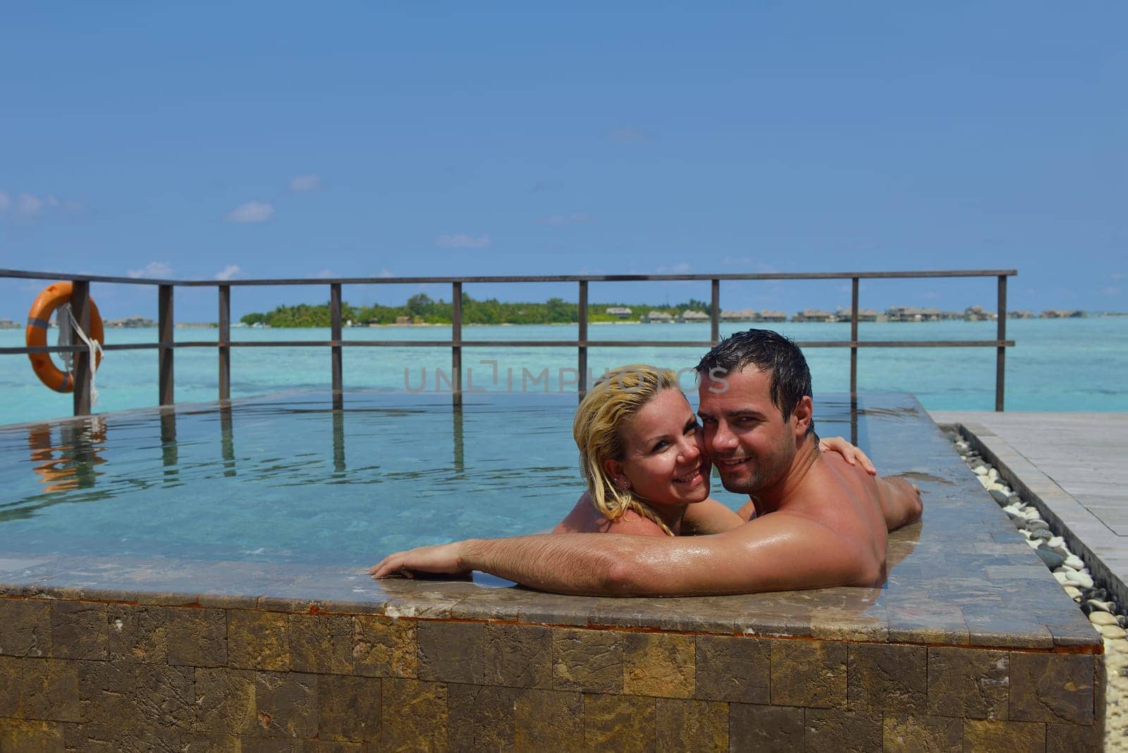 happy young  couple at summer vacation have fun and relax at beautiful sunny  day on beach