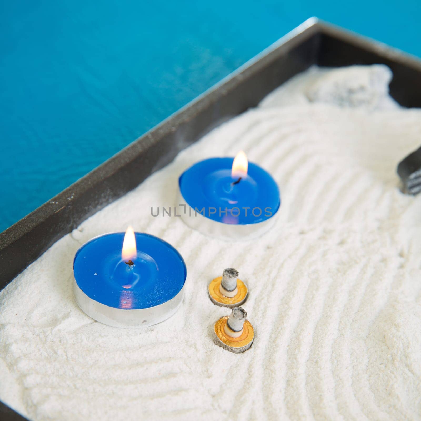 Zen little garden with blue candles and moxa for moxibustion acupunture