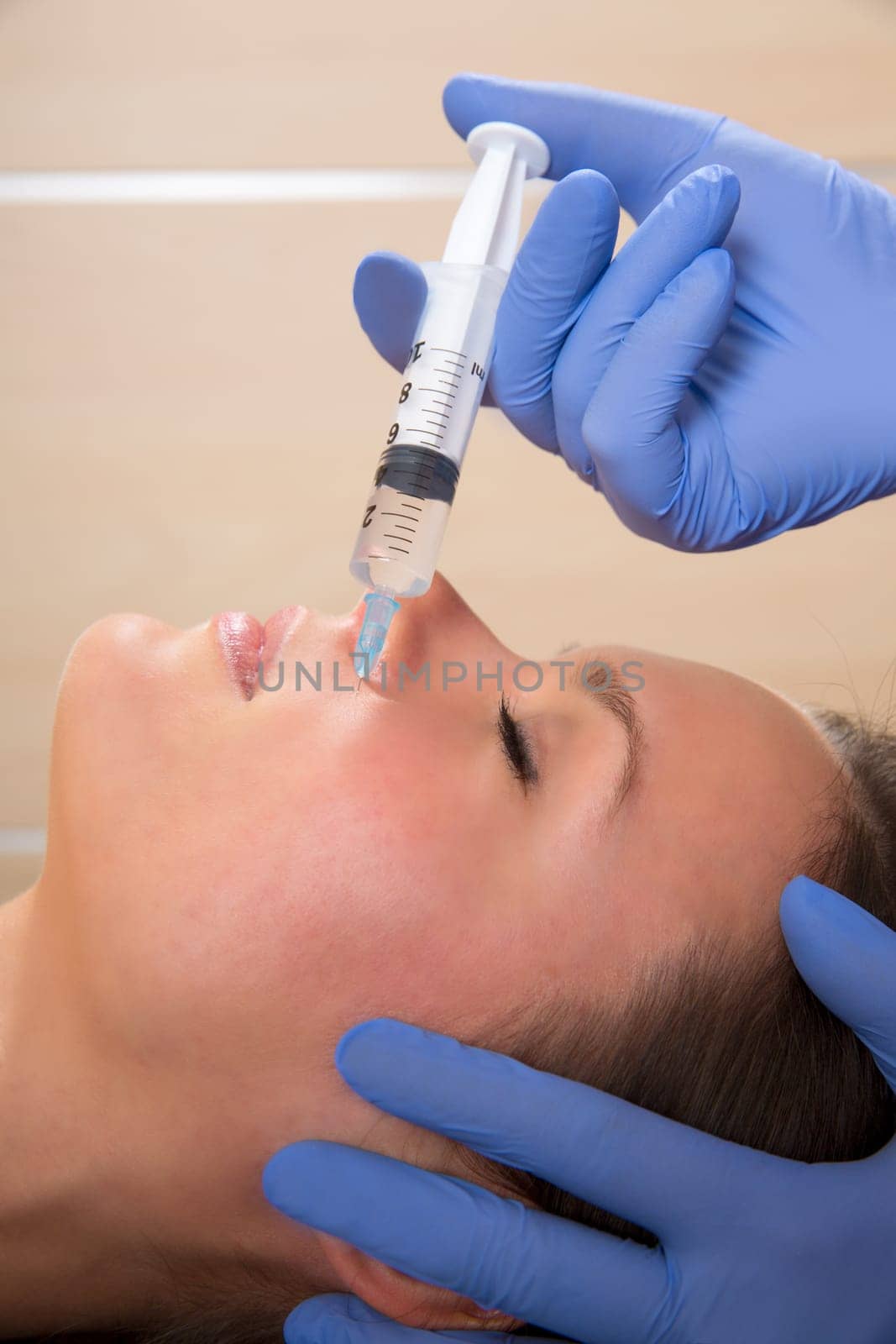 Anti aging facial mesotherapy with syringe closeup  on woman face