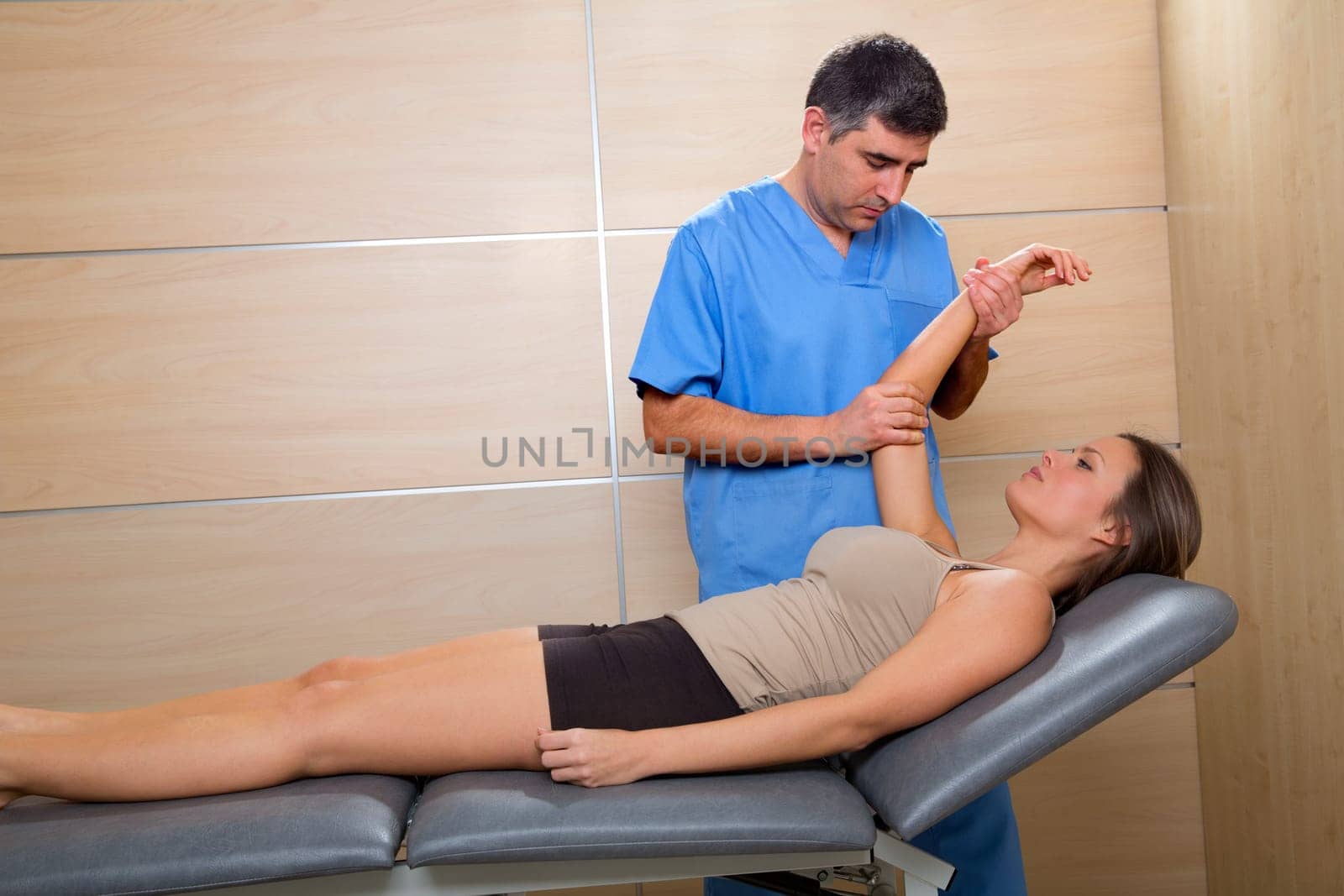 Shoulder physiotherapy doctor therapist and woman patient at hospital