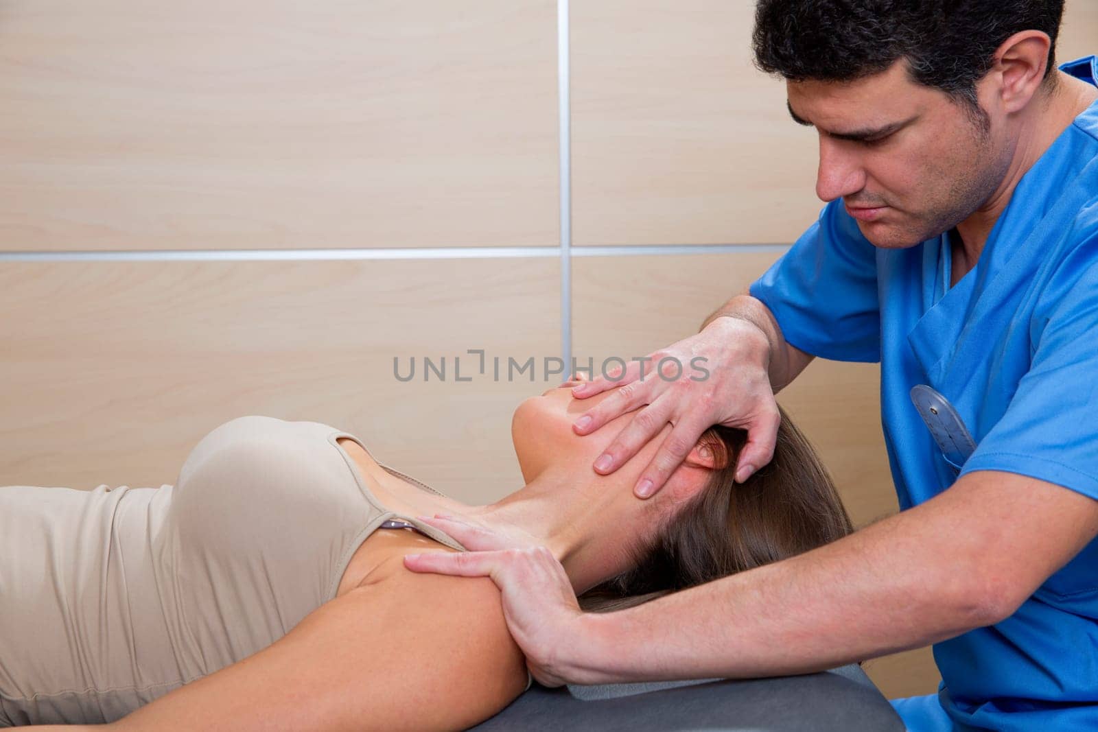 cervical stretching therapy with therapist doctor hands in woman neck