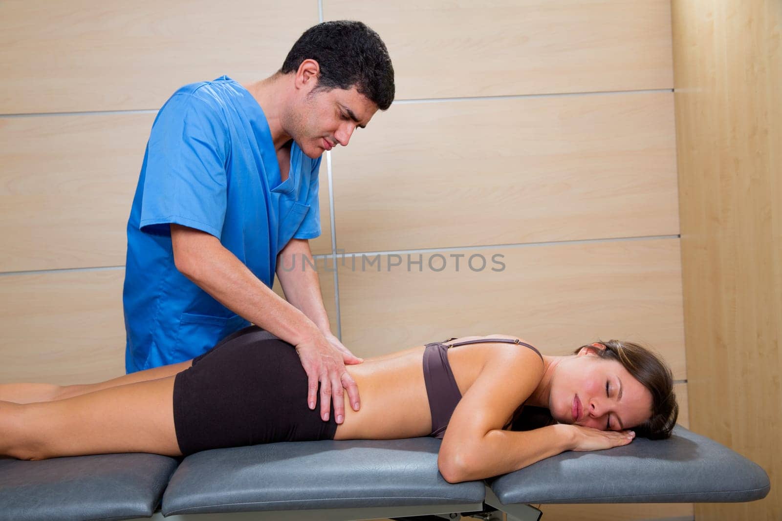 Doctor lumbar exploration on woman patient therapy