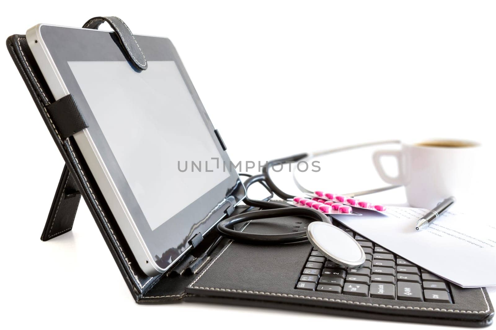 Digital tablet pc , pills and stethoscope, health concept on white background