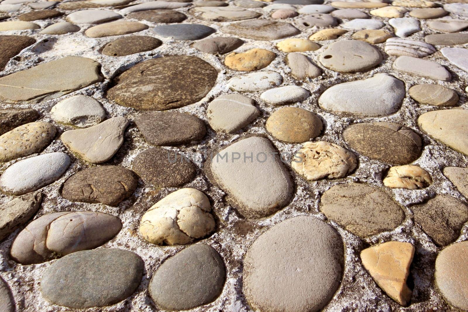 a wall texture stone shaped pebbles in concrete
