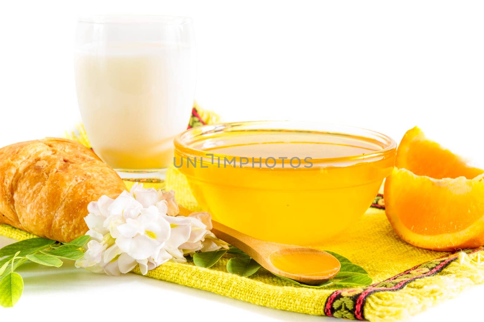 Breakfast with honey, milk and oranges