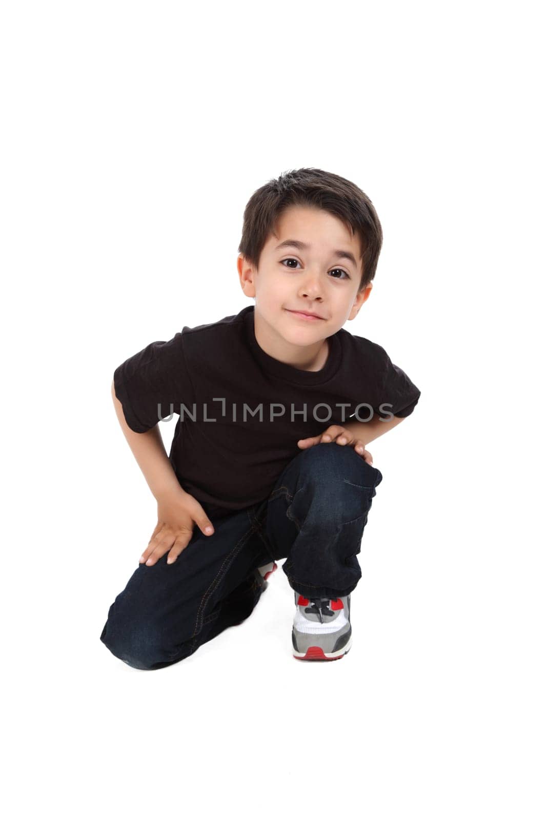 Young boy in studio with black shirt and jeans