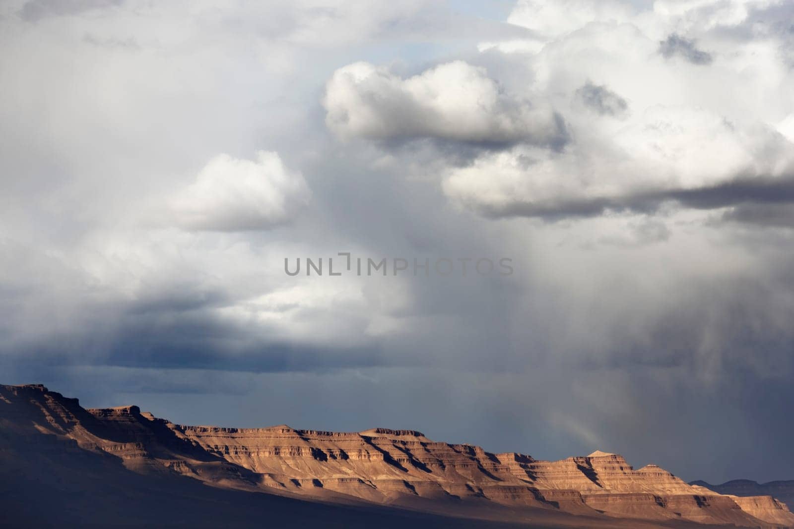 Jebel Kissane mountains in the Draa Valley during stormy weather, Sahara desert, Morocco.