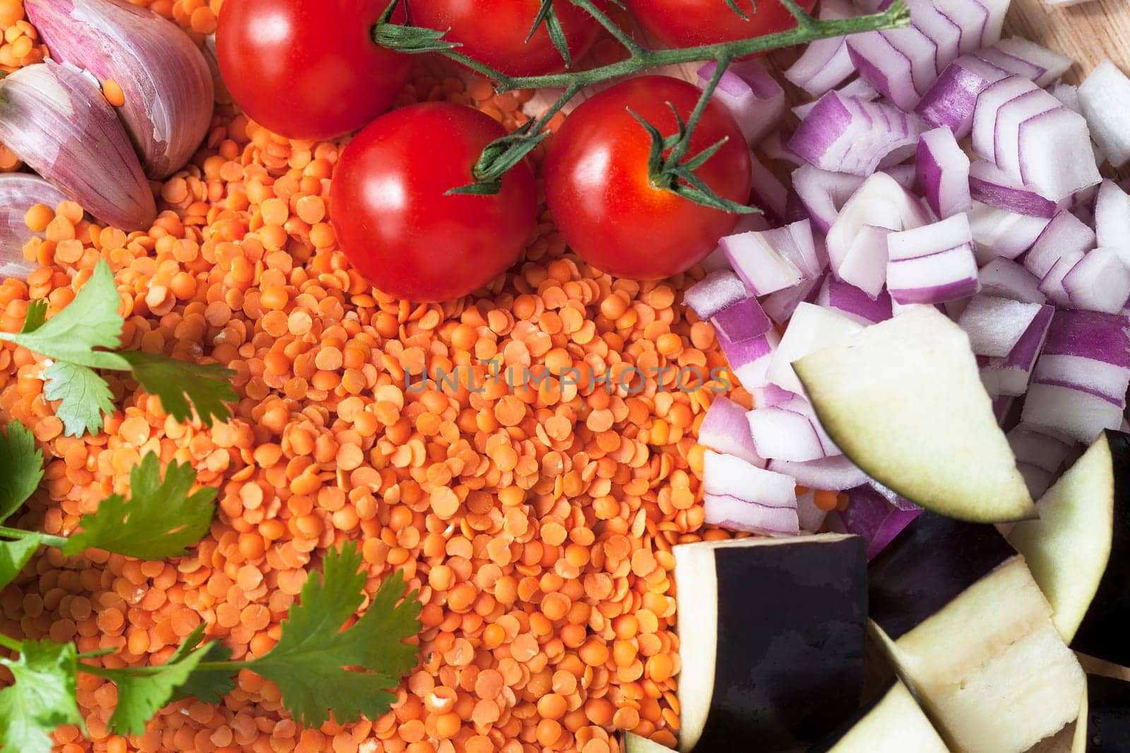 Ingredients for red lentil curry with aubergine and cherry tomatoes.