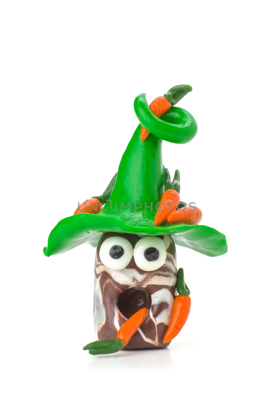 Handmade clay figure with carrots