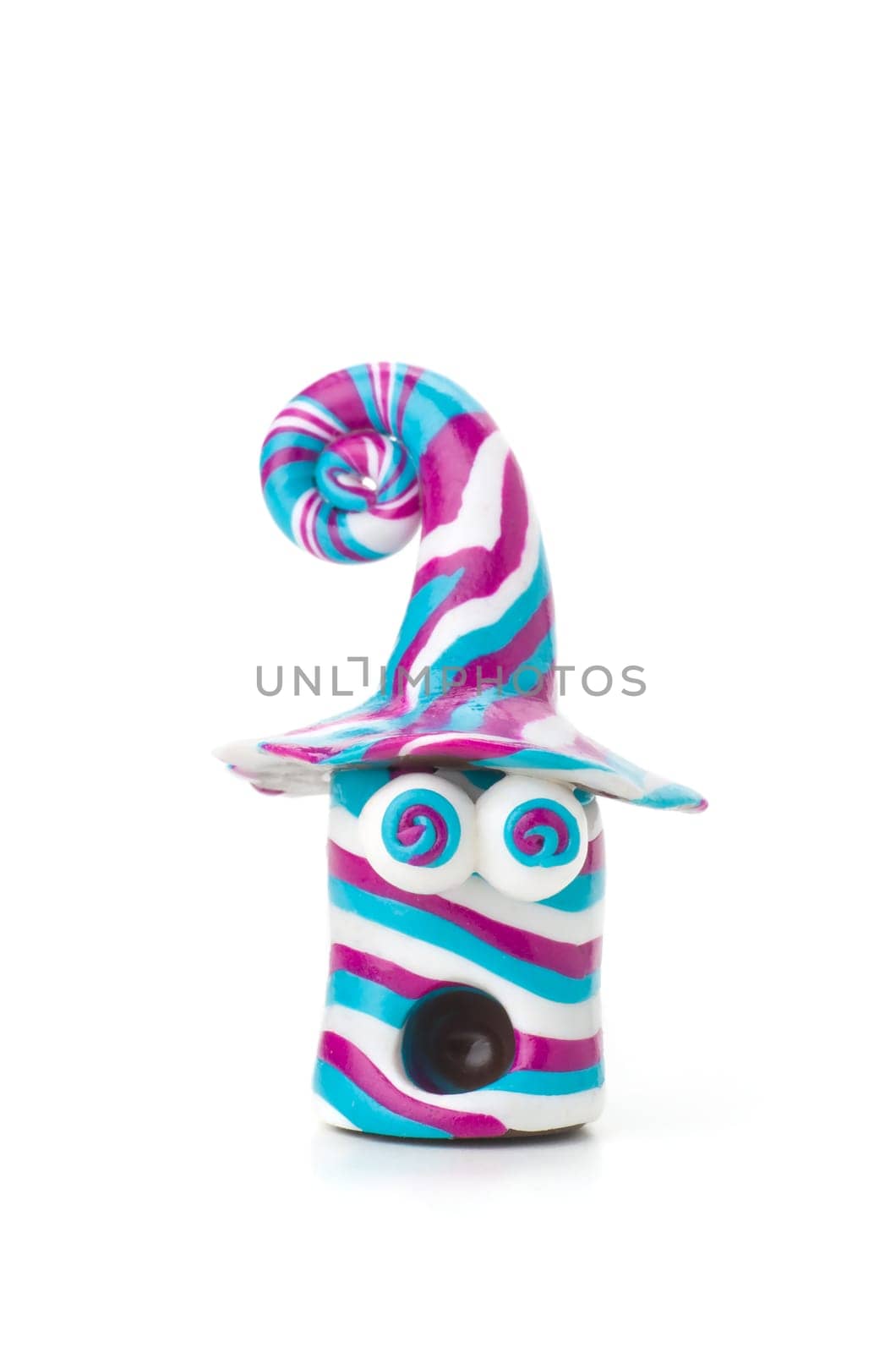 Handmade clay figure with rolled eyes