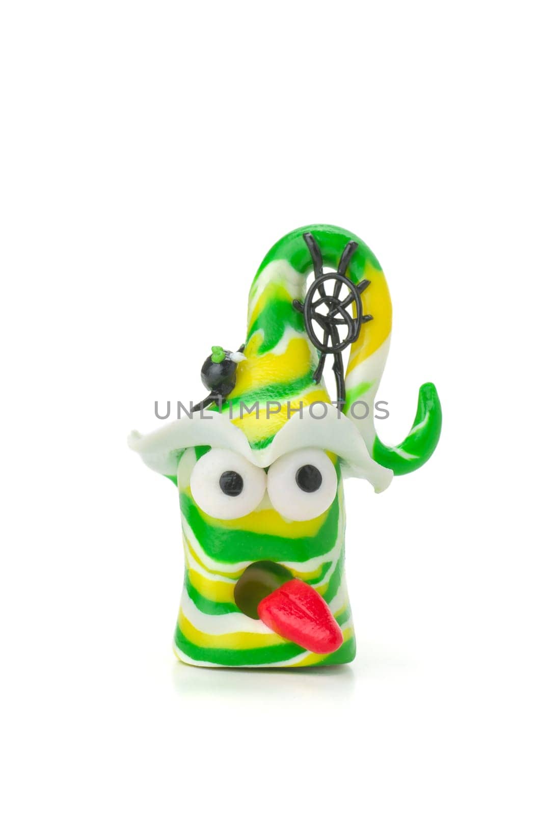 Handmade clay figure with spider and web