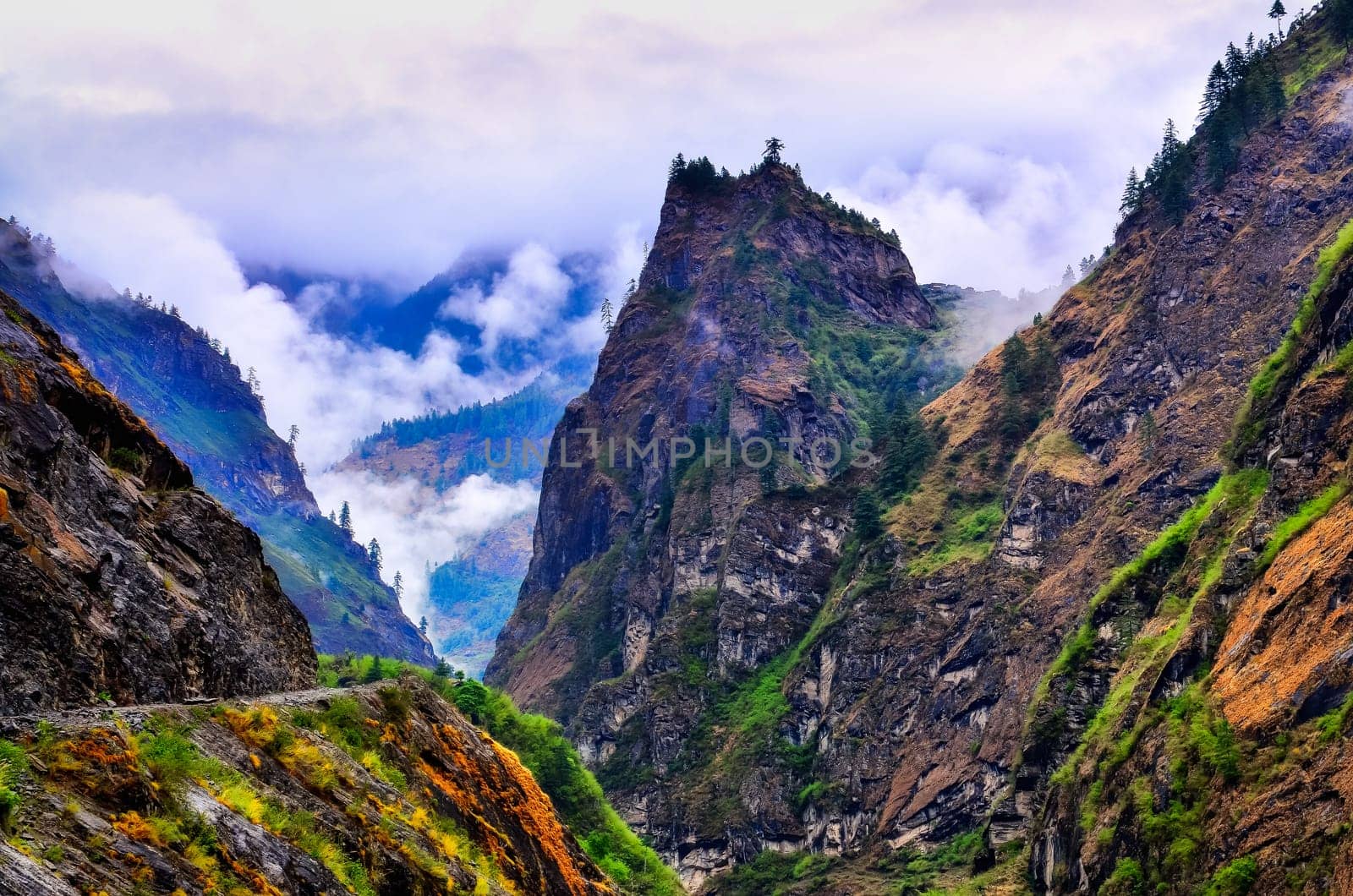 Wild mountain valley during cloudy misty day, Himalayas area, Nepal