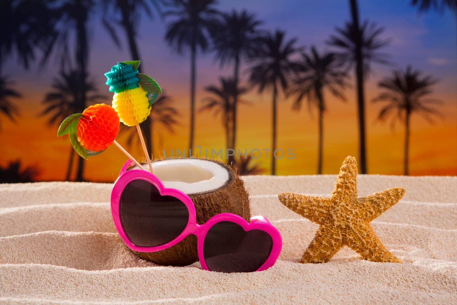Coconut cocktail on tropical white sand beach heart shape funny sunglasses