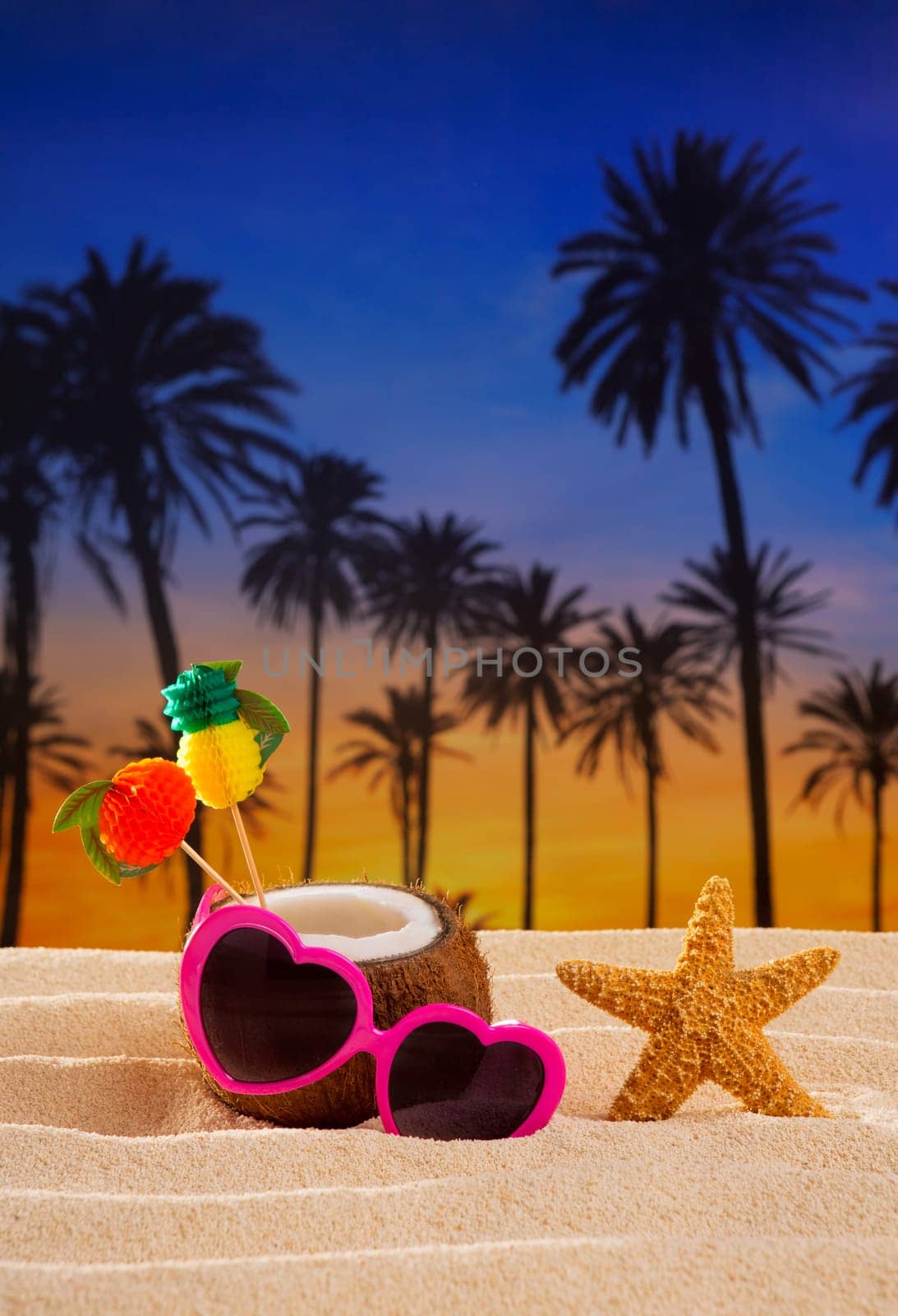 Coconut cocktail on tropical white sand beach heart shape funny sunglasses