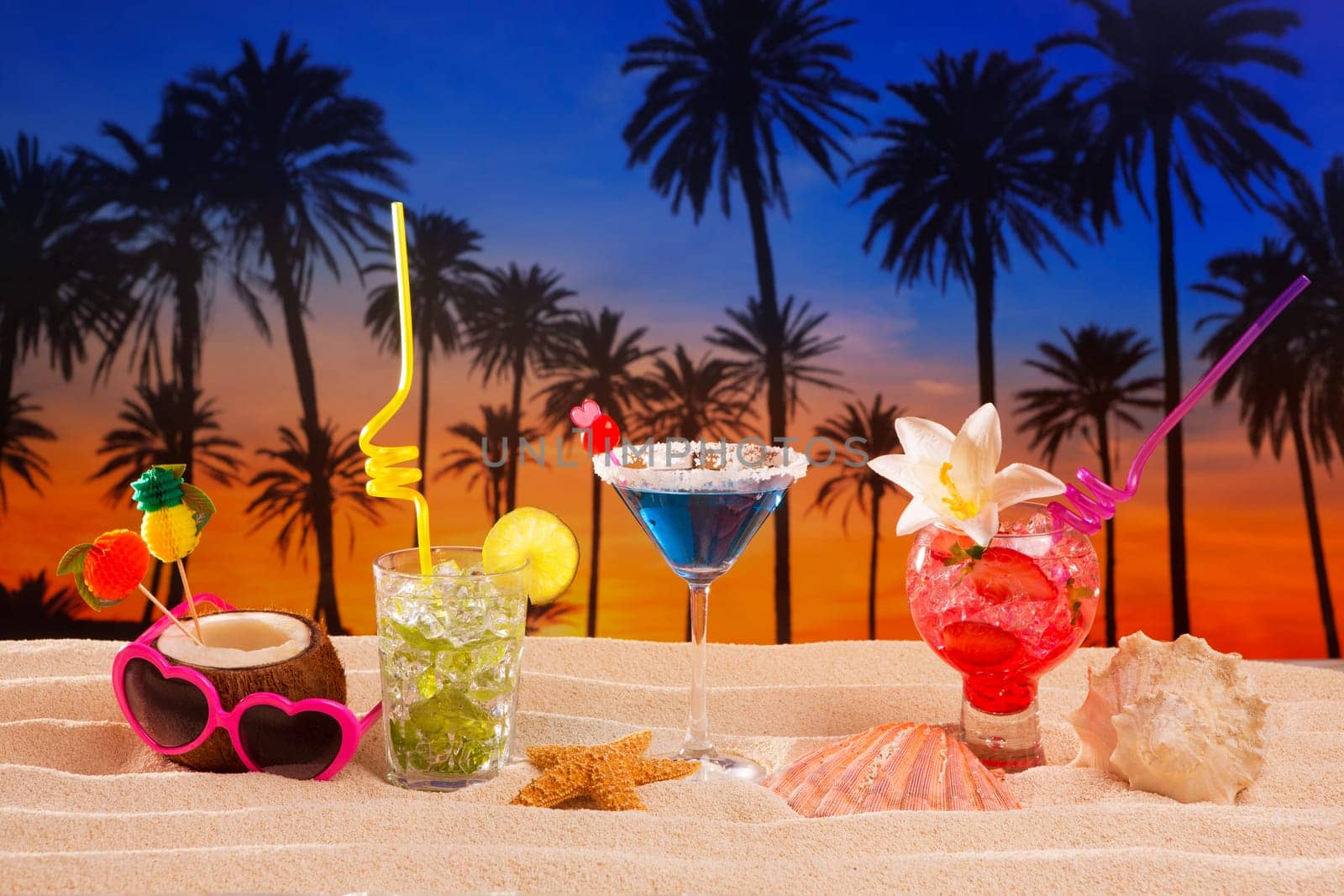 beach tropical cocktails on white sand mojito blue hawaii on sunset palm trees