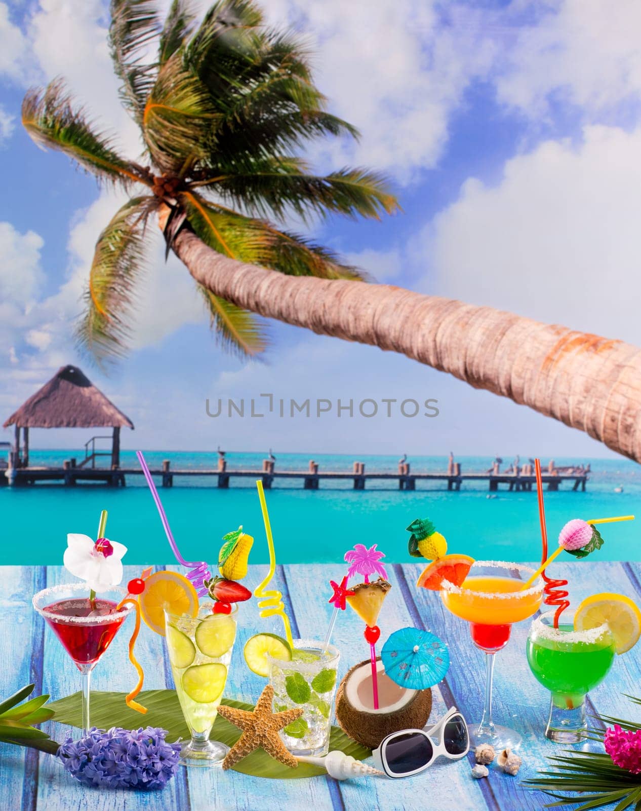 Beach colorful many tropical Cocktails in tropical blue wood with coconut mojito pepermint margarita and palm tree