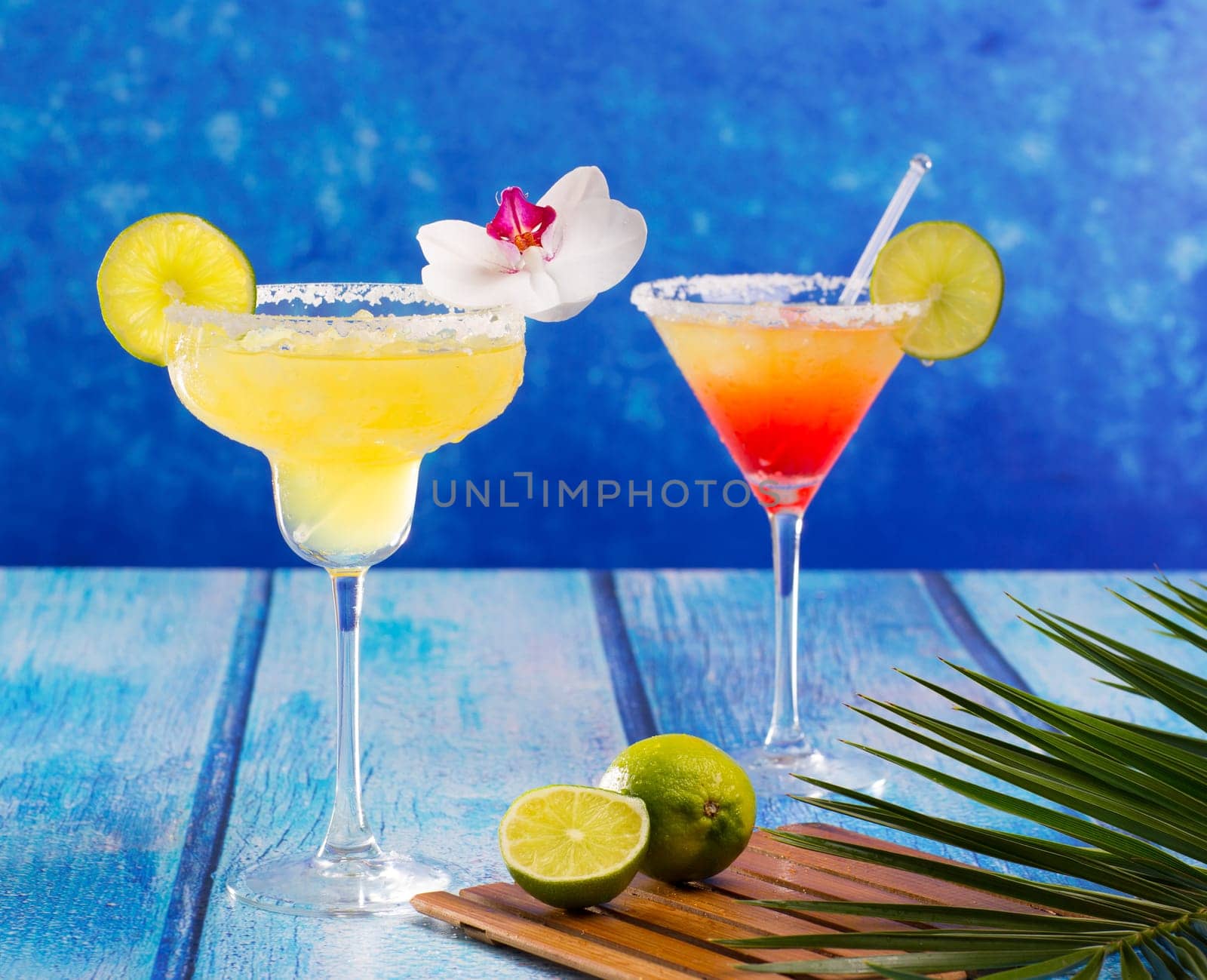 Cocktails mexican Margarita and sex on the beach on blue Caribbean wood