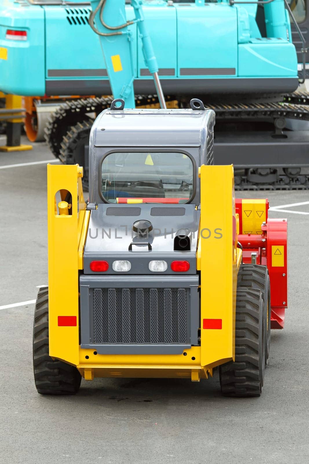 Skid steer front loader machine at construction site