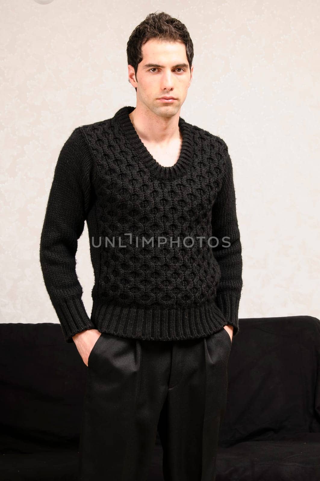 Young man with a Mediterranean look cool wearing casual clothes and posing in front of the camera.