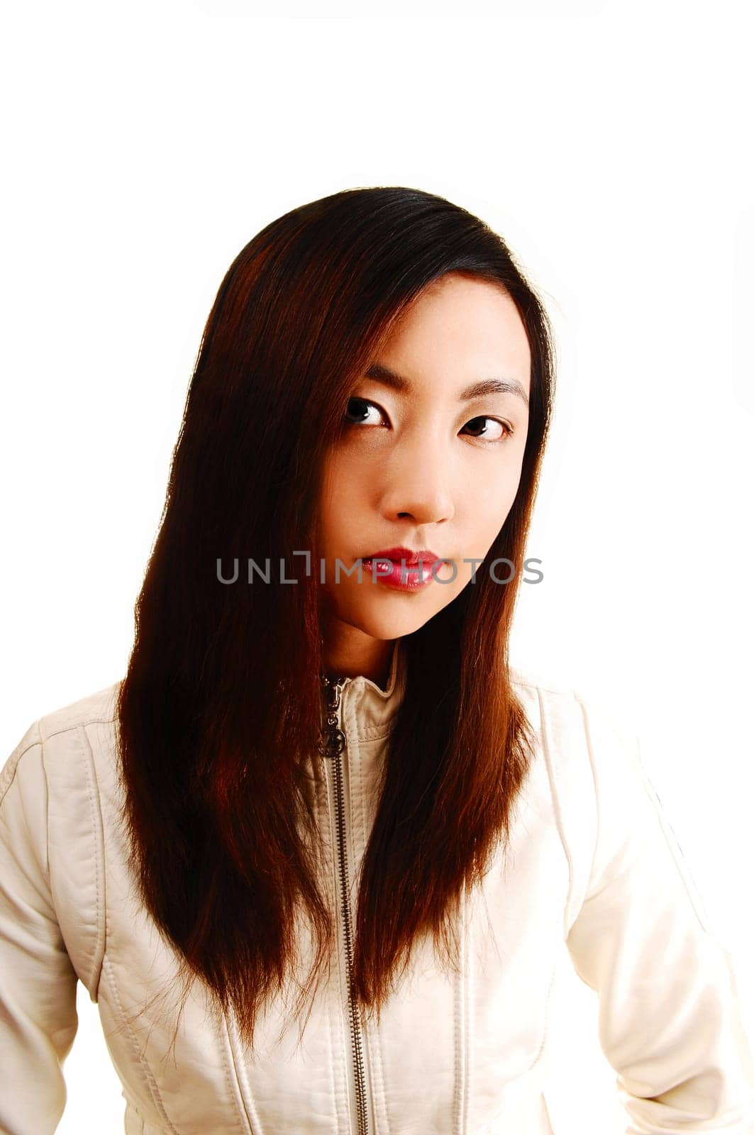 A portrait shoot of a young beautiful chinese woman for white background in a white jacket and brunette hair.