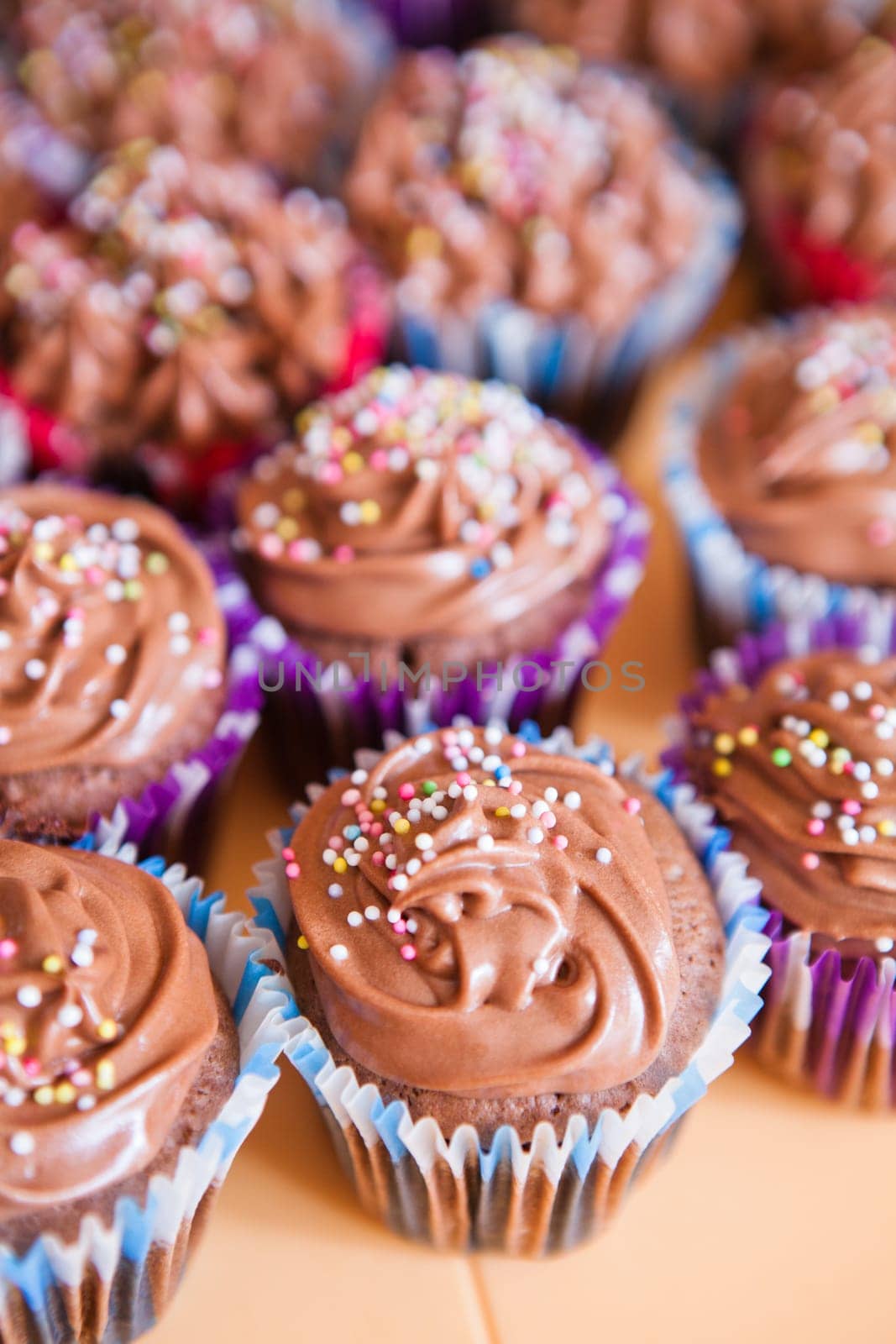 Closeup of chocolate cupcakes with decorative sprinkles