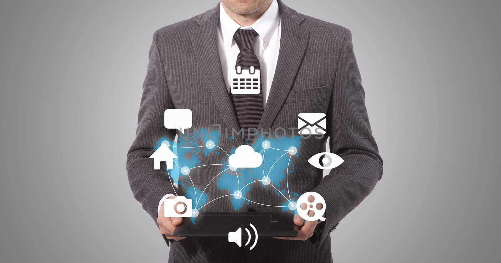 business man holding a tablet with social media connection, grey background. world map from www.lib.utexas.edu