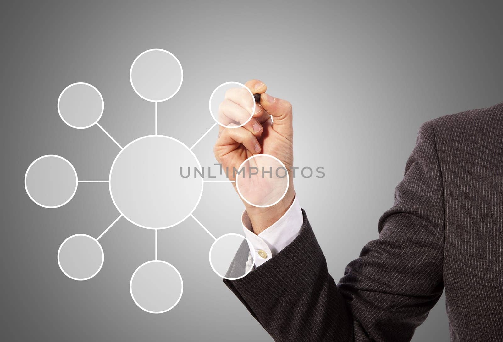 Male hand drawing social network structure, grey background