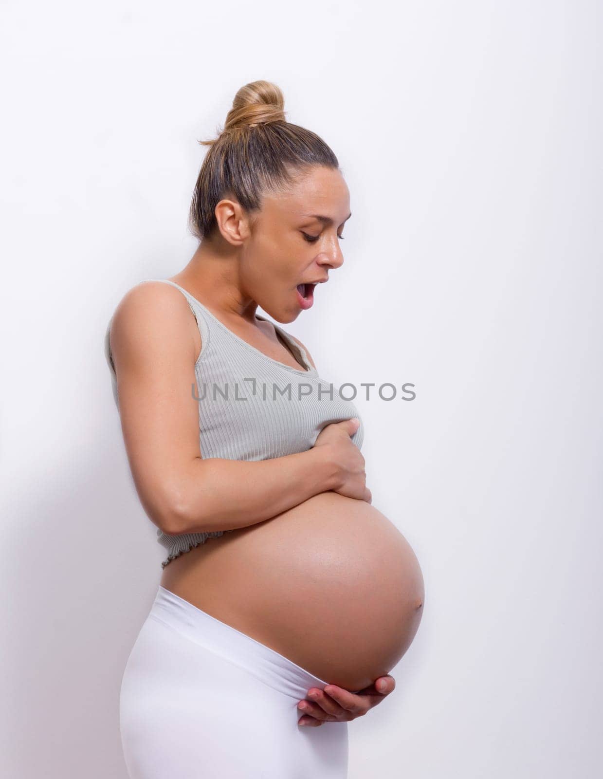 pregnant woman holding her belly very big