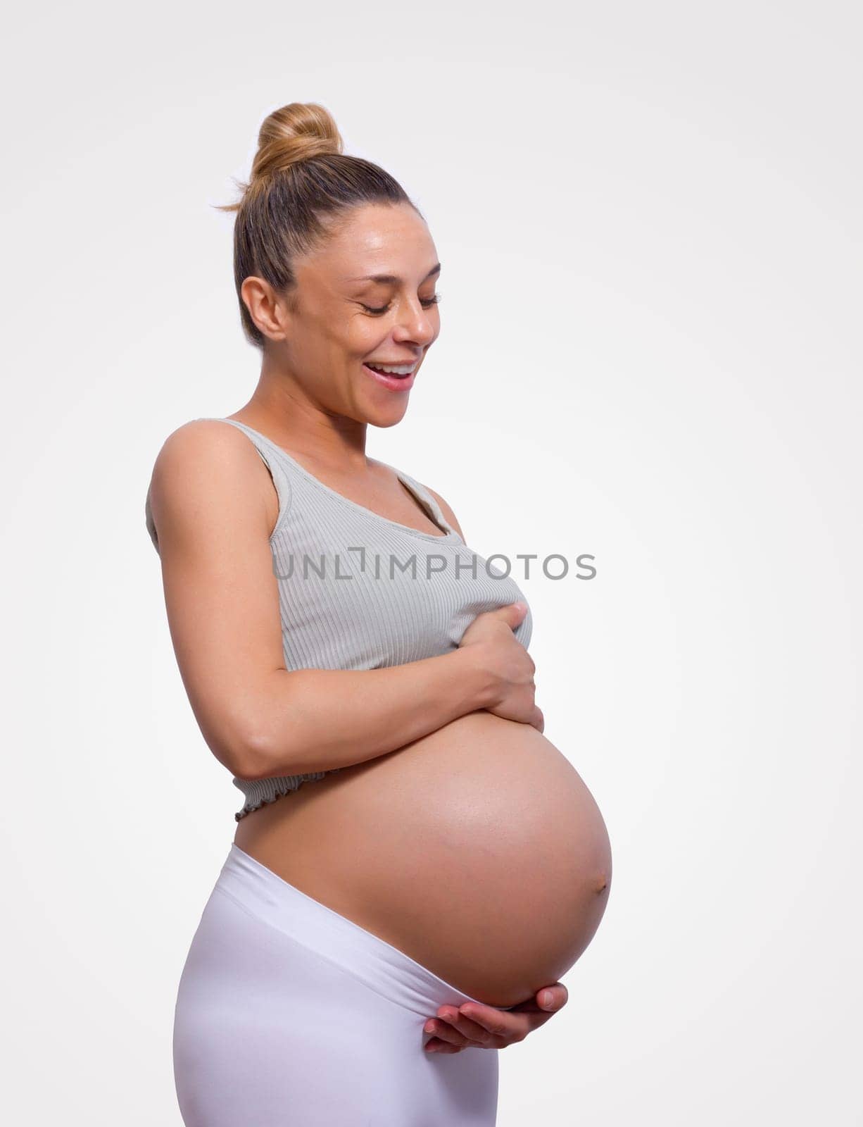 pregnant woman holding her belly and wait for new born