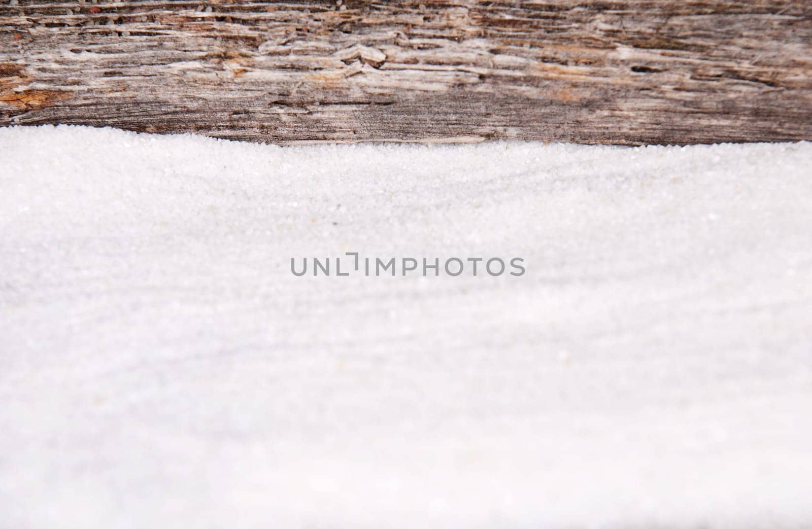 sand and a pice of driftwood as background
