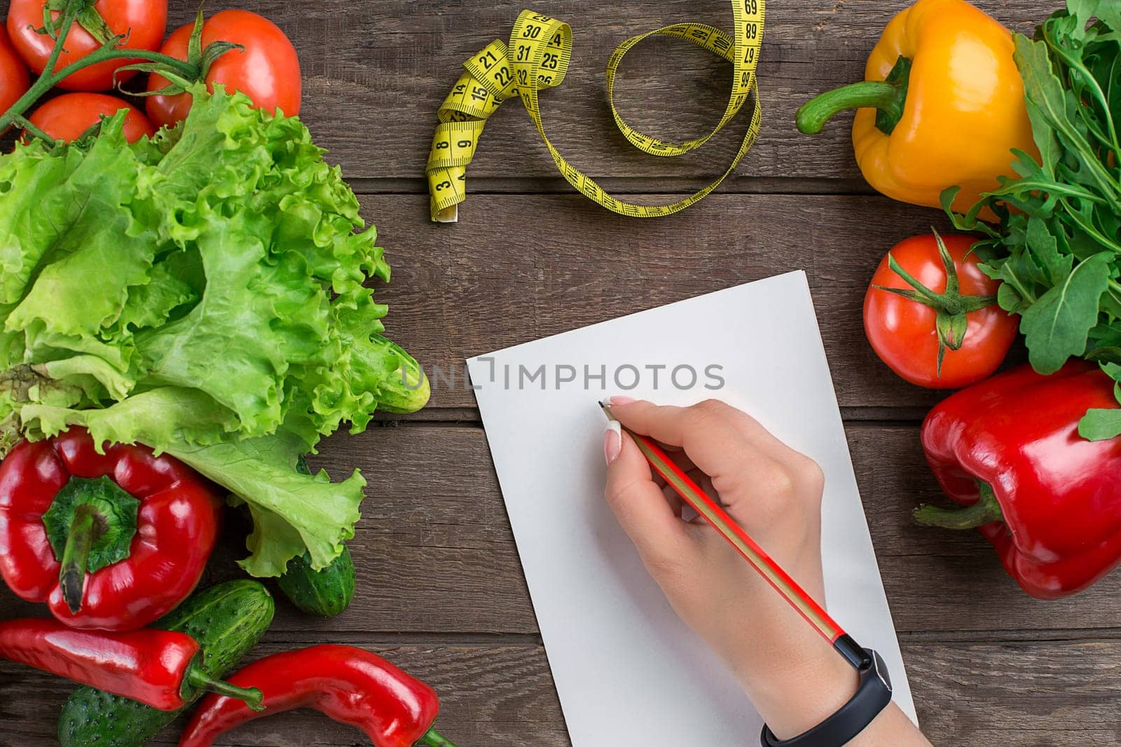 Sport and diet. Vegetables and centimeter. Peppers, tomatoes, salad on rustic background. Top view. Copy space