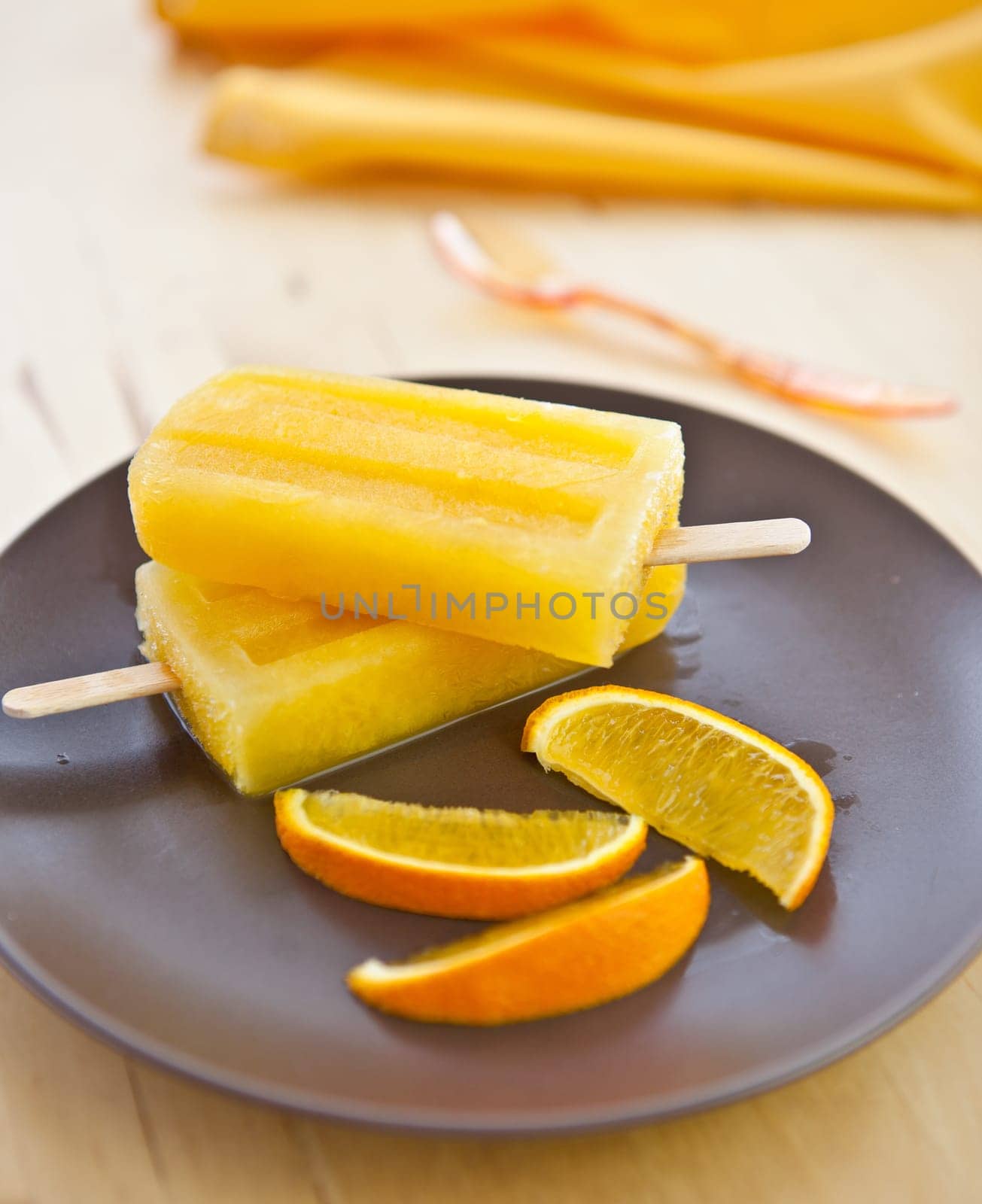 Homemade Orange ice popsicles