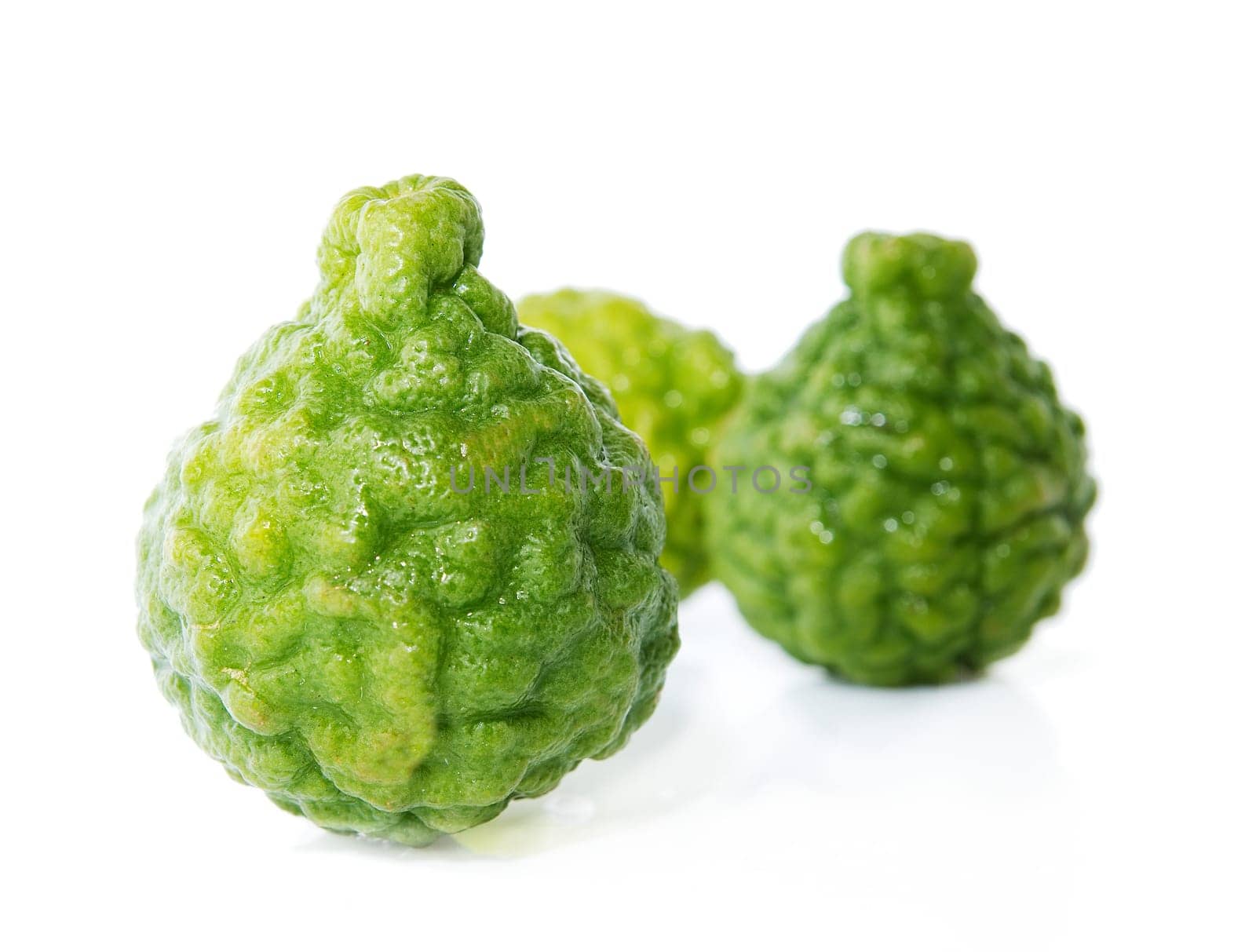 Fresh green lime. Kafir. Isolated over white