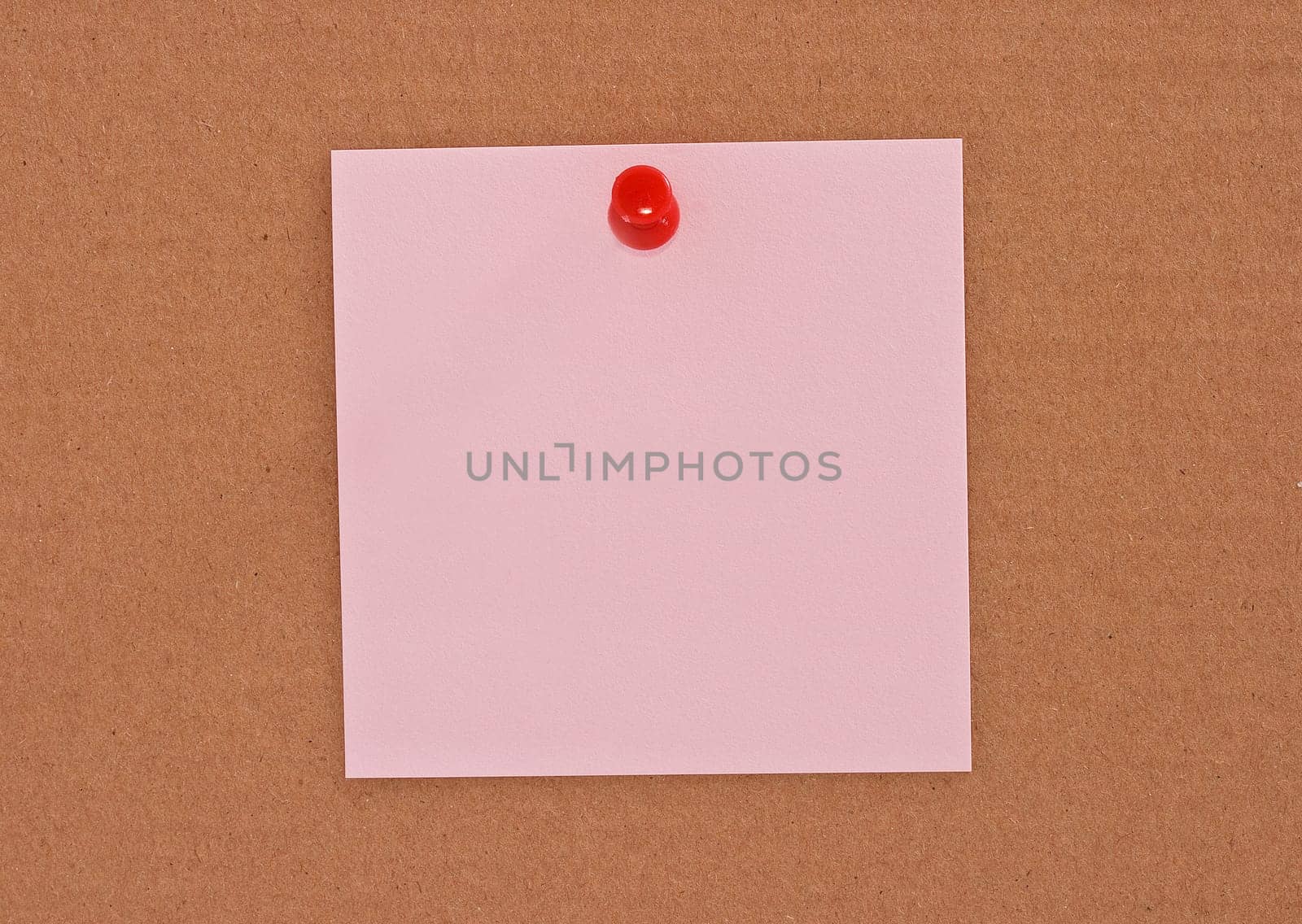 Pink note paper attached with red pin