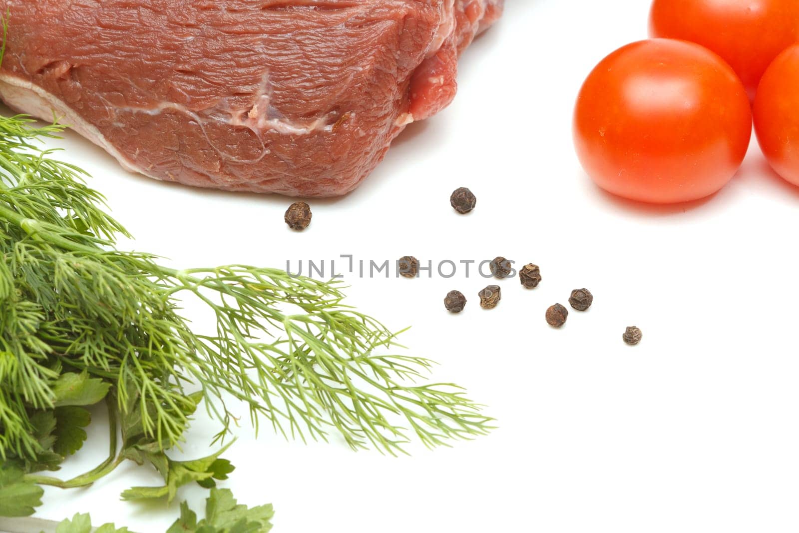 Piece of beef and vegetables isolated on white background