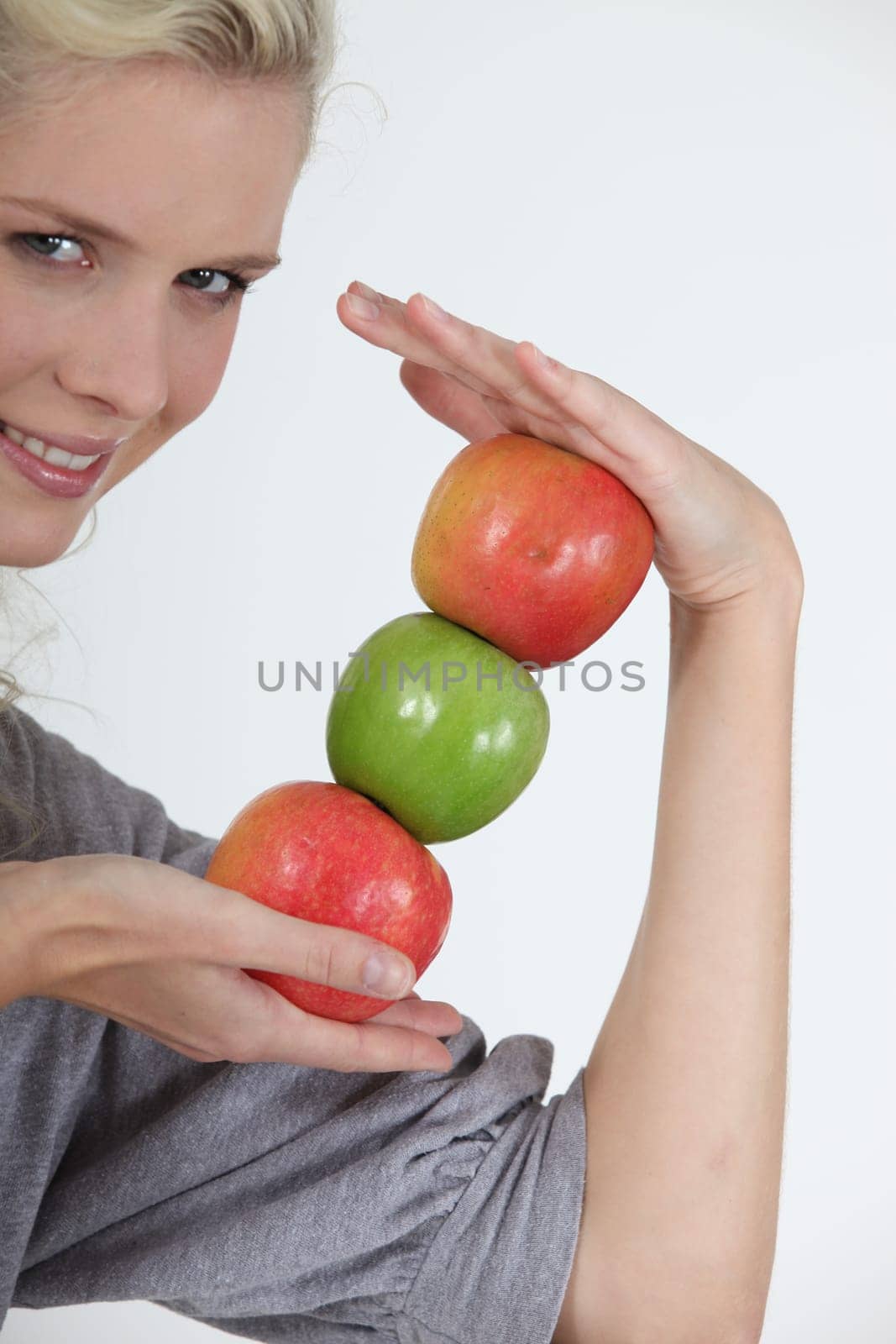 young woman holding apples