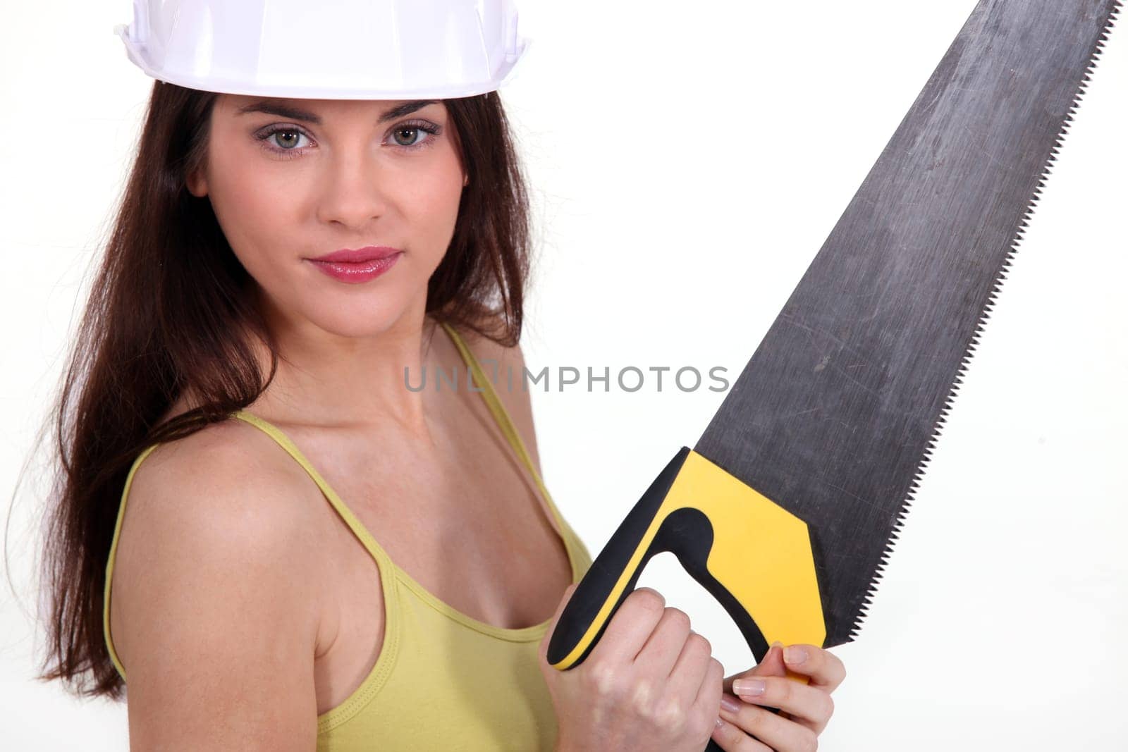 Young woman with a saw