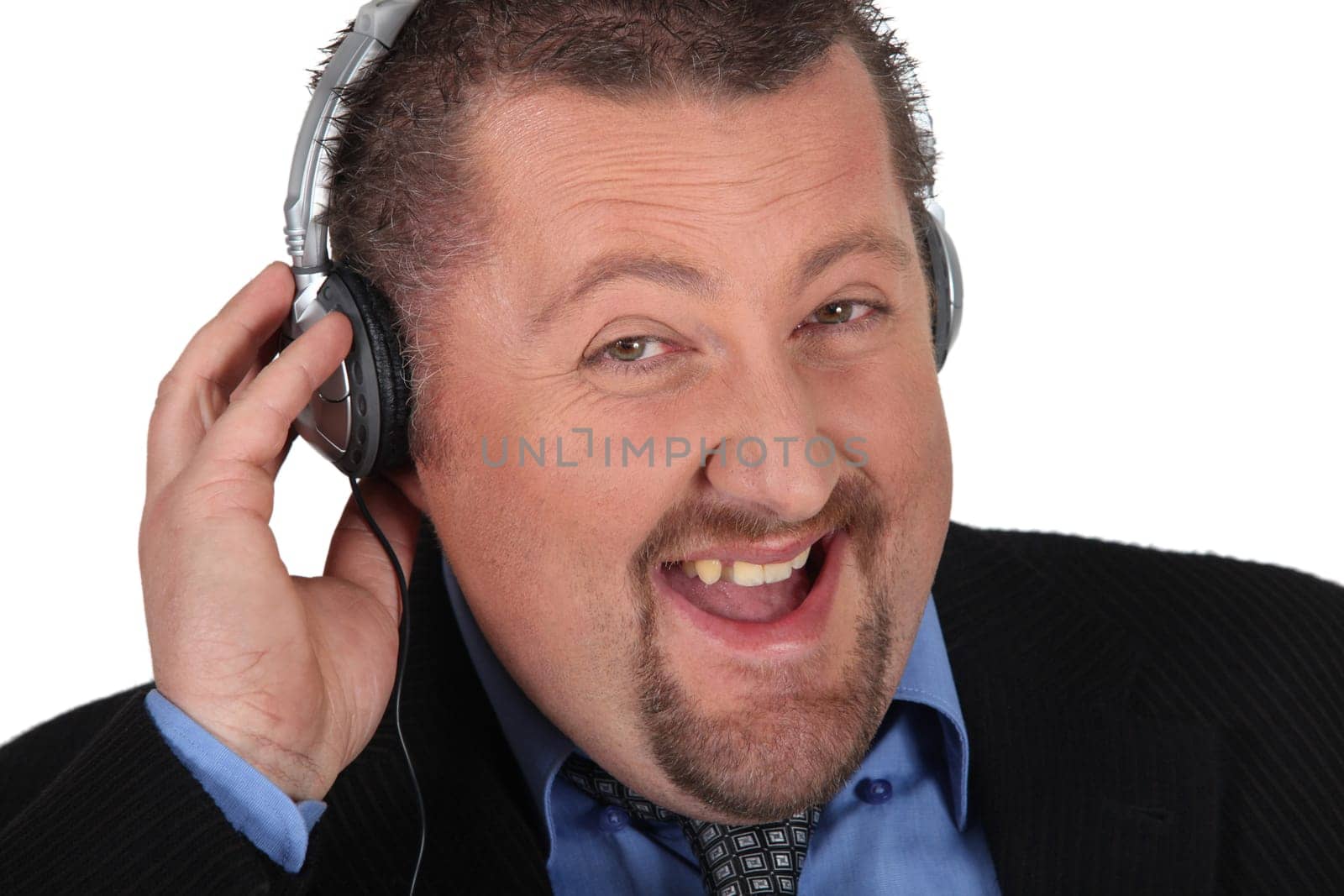 Businessman listening to music