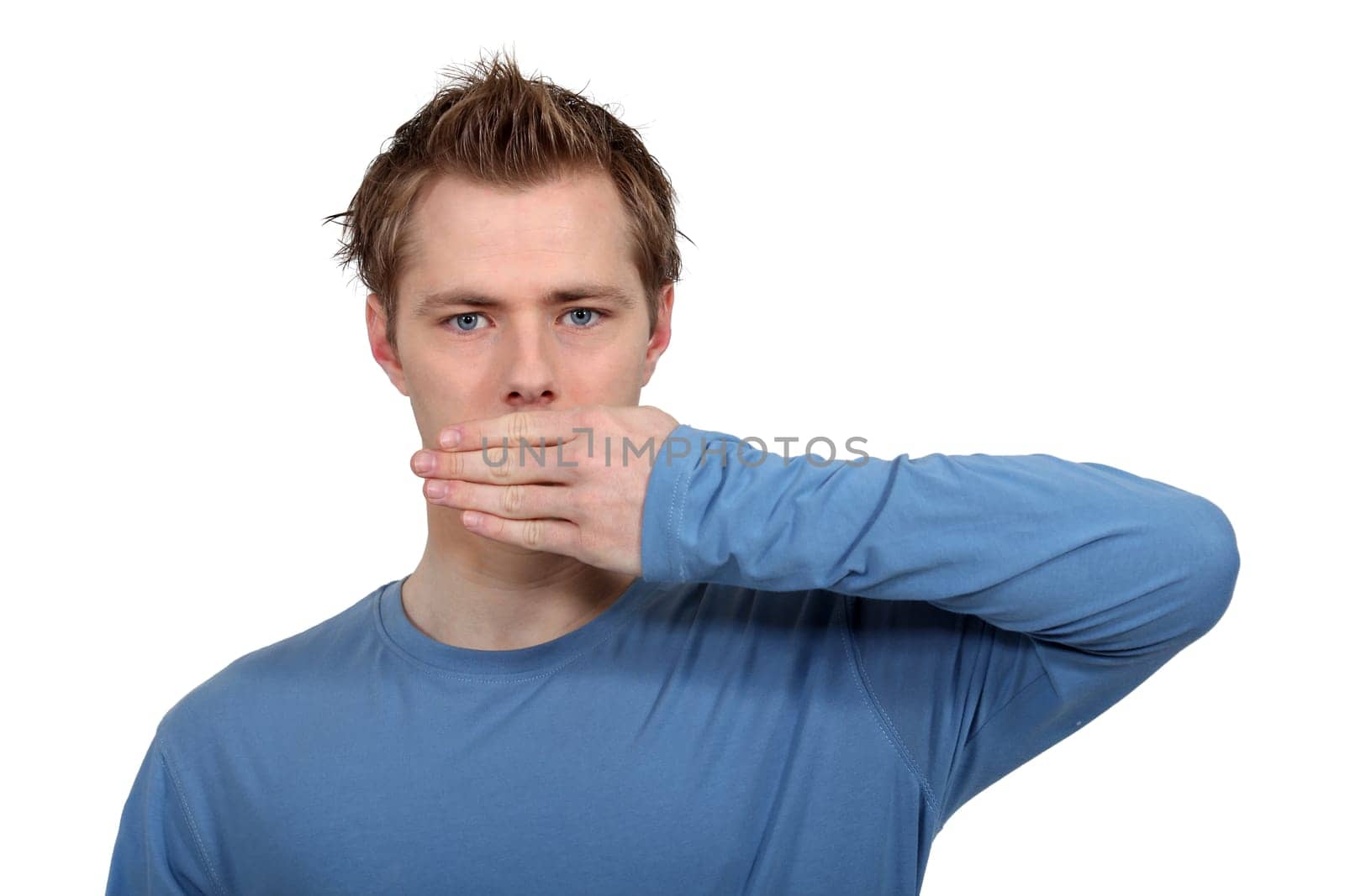Man with hand on mouth