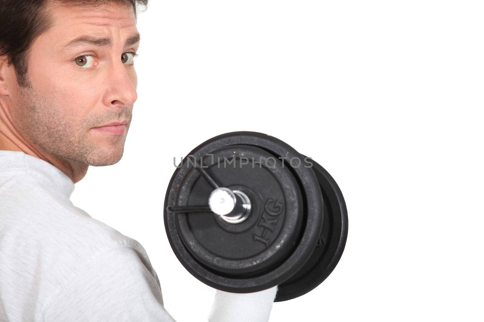 portrait of a man with dumbbell