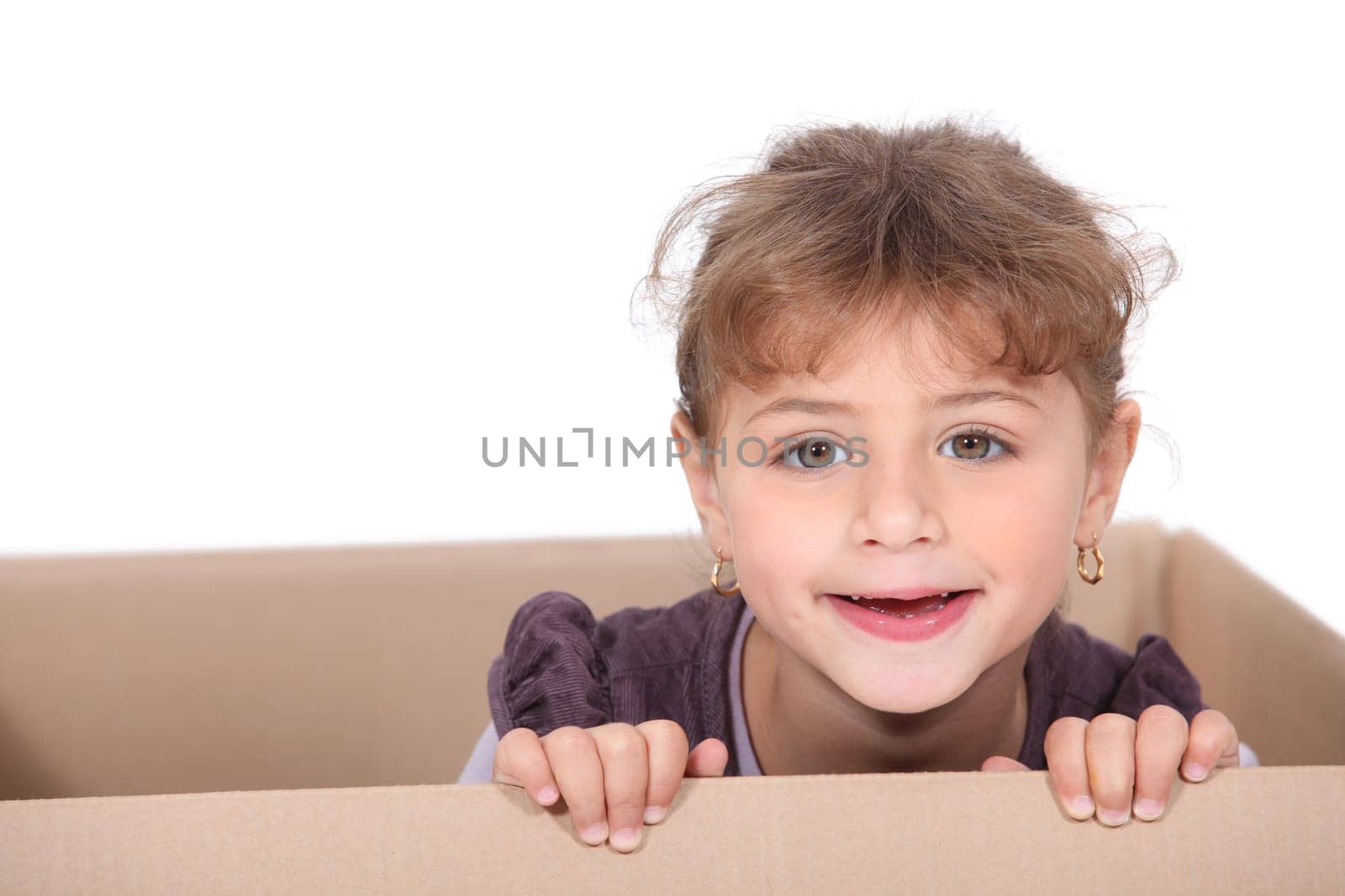 Child playing in a box