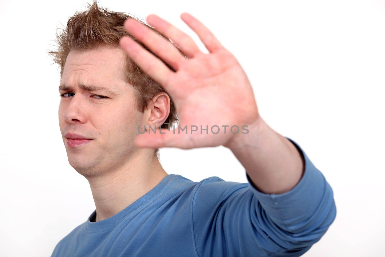 Man making stop gesture