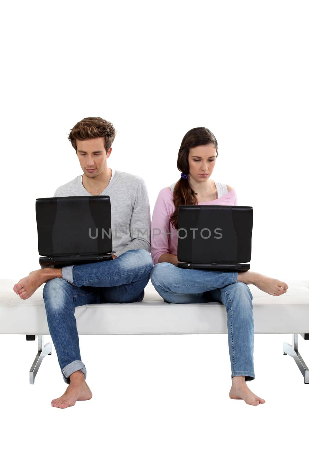 Young couple working on their laptops