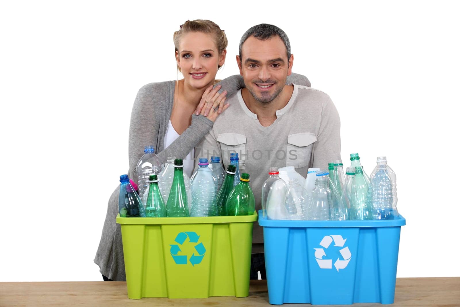 Enthusiastic couple recycling