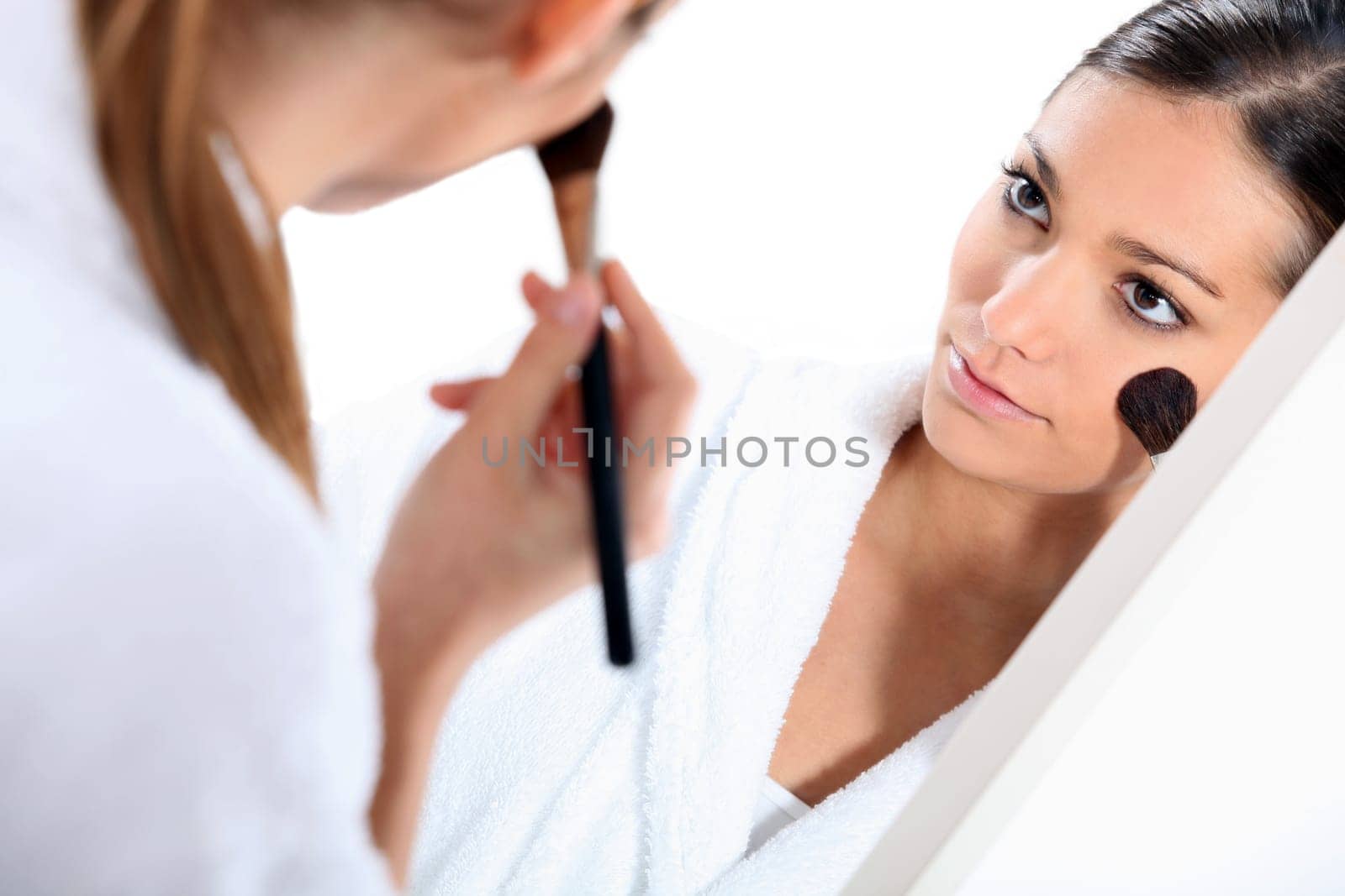 Woman applying blusher