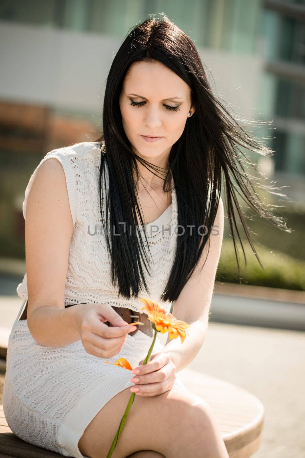 He loves me, he loves me not game - Woman with flower