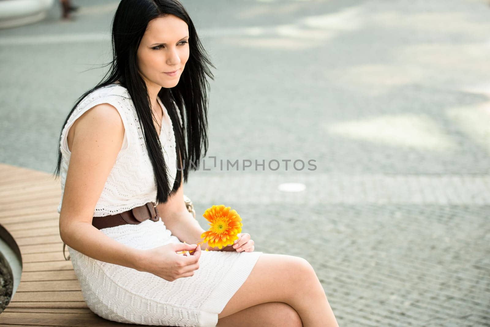He loves me, he loves me not game - Woman with flower