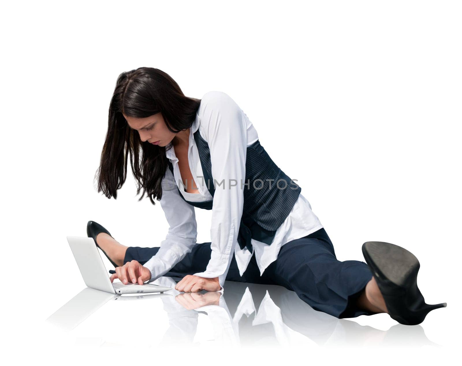 Young business woman in gymnastics pose working with computer - isolated on white