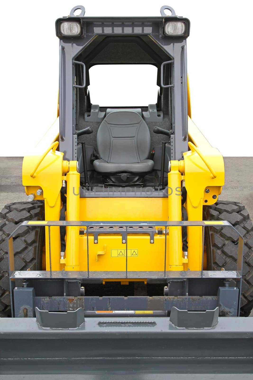 Skid steer front loader machine at construction site